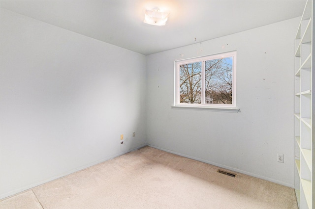 unfurnished room featuring carpet