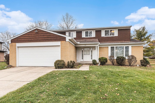 view of front of property with a front yard and a garage