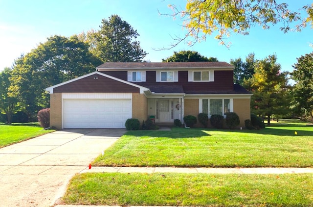 view of front of property featuring a front yard and a garage