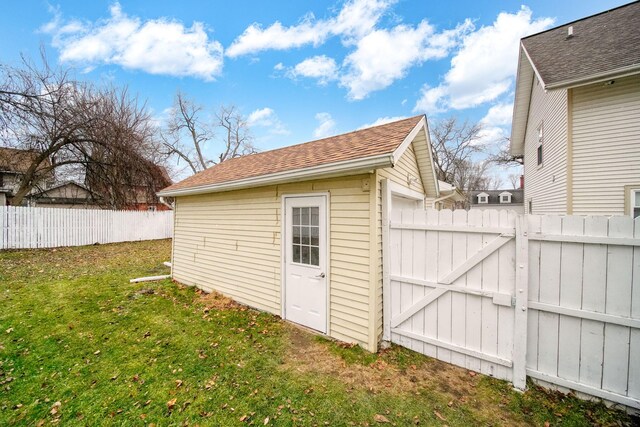 view of outbuilding with a yard