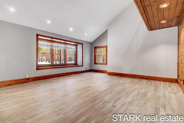 unfurnished living room with light hardwood / wood-style floors and high vaulted ceiling