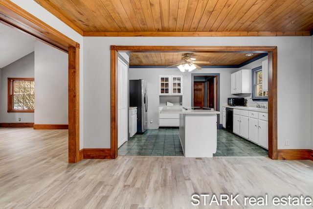 kitchen featuring wooden ceiling, hardwood / wood-style floors, plenty of natural light, white cabinets, and black appliances