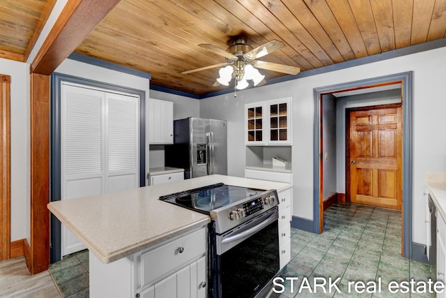 kitchen with appliances with stainless steel finishes, a center island, white cabinetry, and wood ceiling