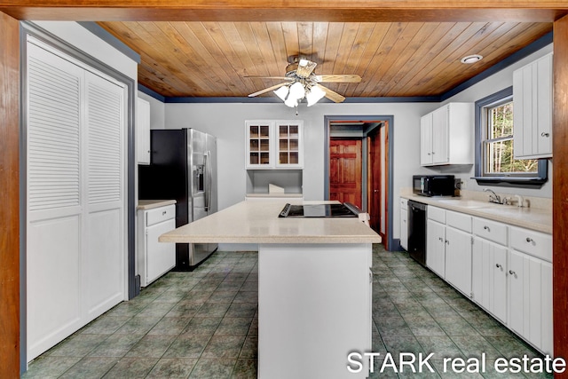 kitchen with a center island, wooden ceiling, black appliances, ceiling fan, and white cabinetry