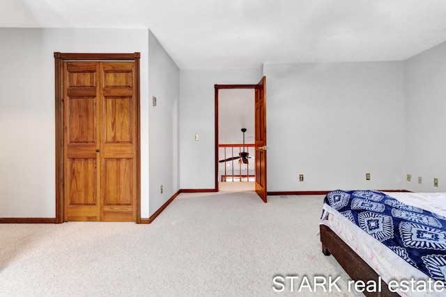 bedroom with light colored carpet