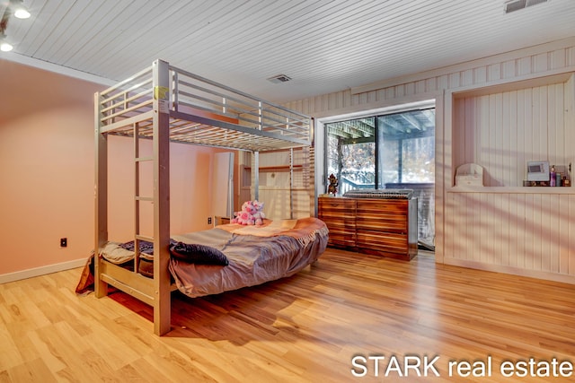 bedroom with hardwood / wood-style floors