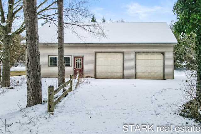 view of snow covered garage