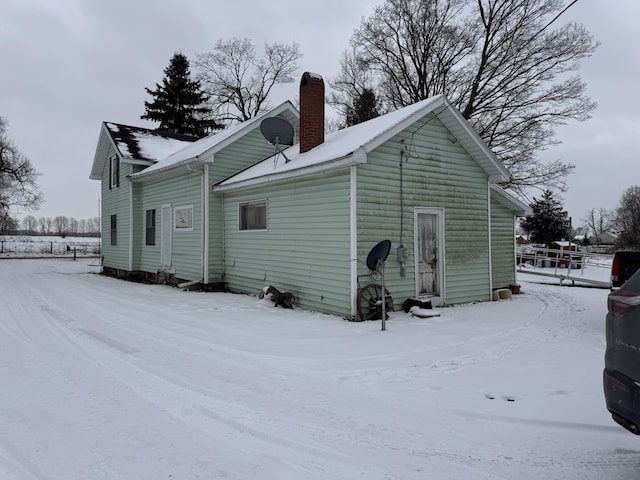 view of snow covered house