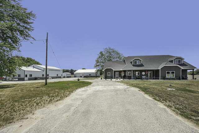 view of front of house featuring a front lawn and a porch