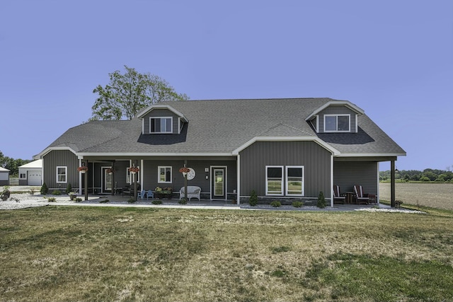 new england style home with a front lawn