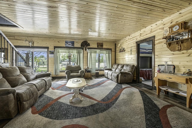 living room with dark hardwood / wood-style floors, wood walls, and wooden ceiling