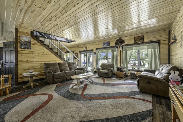 living room with wooden walls and wood ceiling