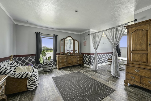 bedroom with crown molding, dark wood-type flooring, and a textured ceiling