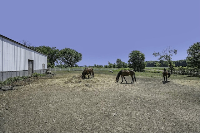 view of yard with a rural view