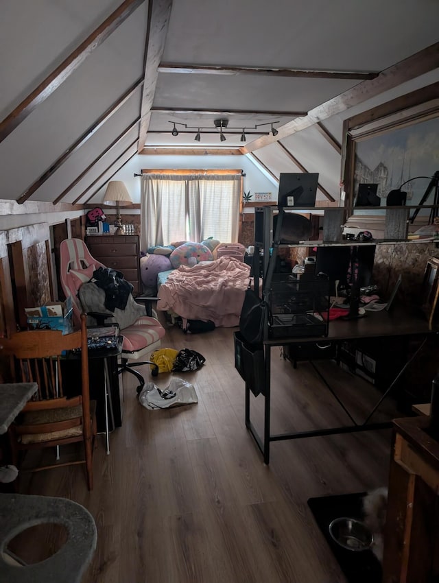 interior space featuring hardwood / wood-style flooring and lofted ceiling