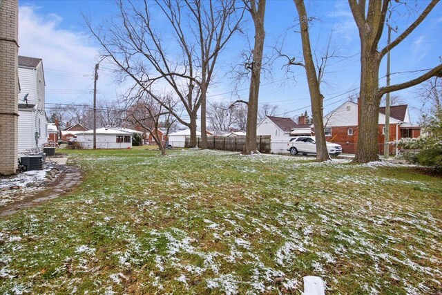 yard covered in snow with central air condition unit