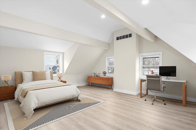 bedroom with vaulted ceiling with beams and light hardwood / wood-style flooring