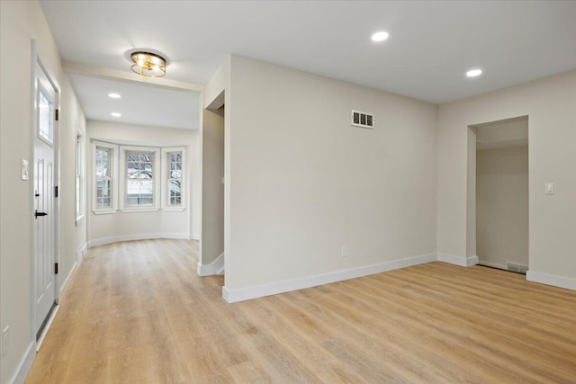 foyer entrance with light hardwood / wood-style floors