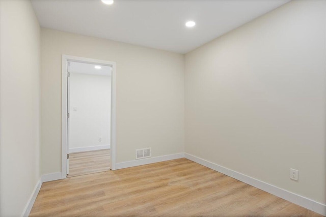 spare room featuring light hardwood / wood-style flooring