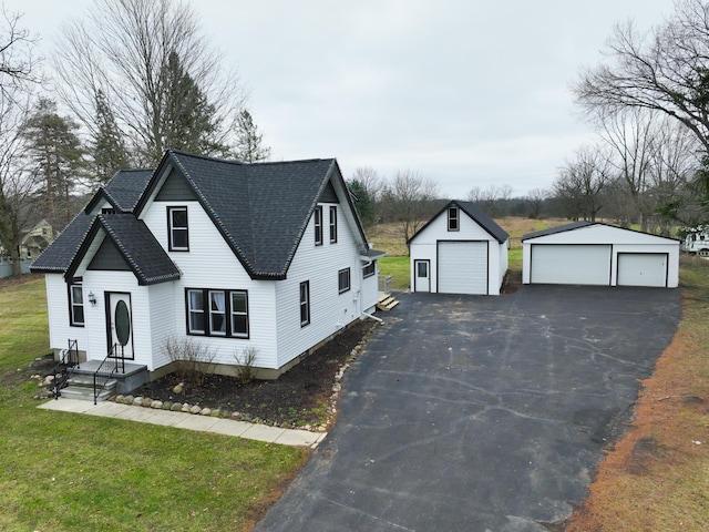 view of front of house featuring an outdoor structure and a garage