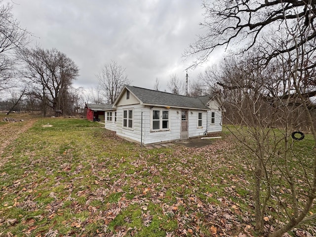 view of home's exterior with a lawn