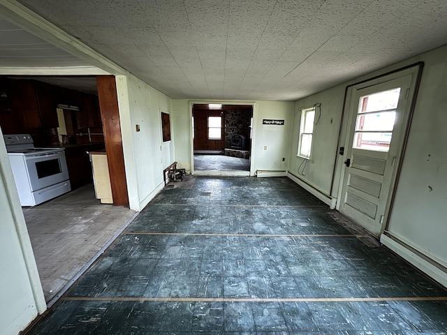 foyer entrance with a stone fireplace