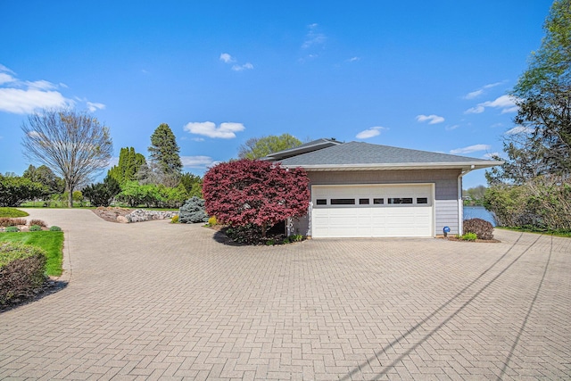 view of side of property featuring a garage