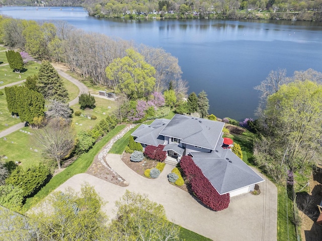 birds eye view of property with a water view