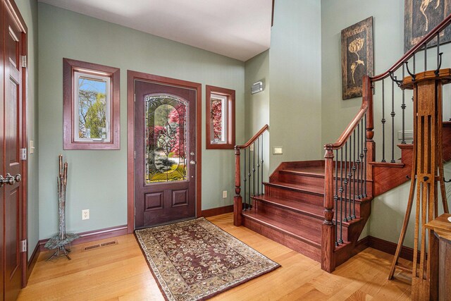 entryway with light hardwood / wood-style flooring