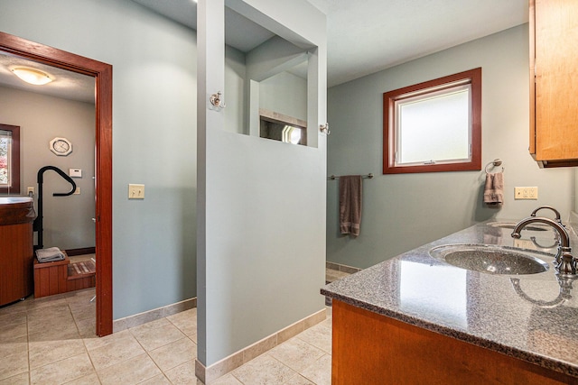 bathroom featuring tile patterned flooring and vanity