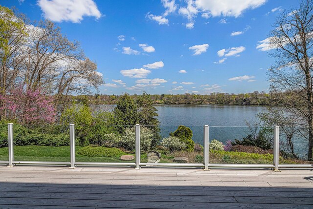 wooden deck with a water view