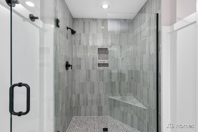 bathroom with a shower stall