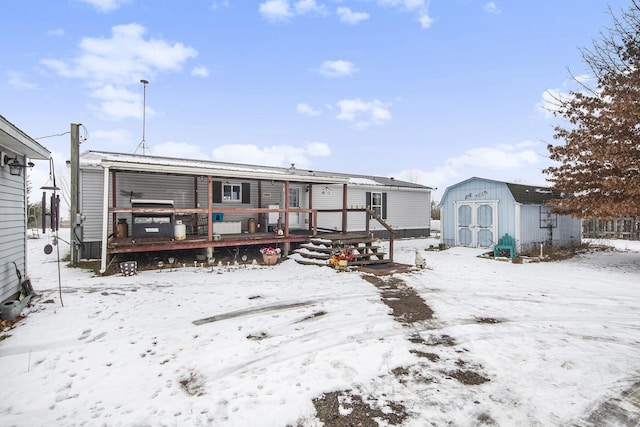 exterior space with a storage unit and a deck