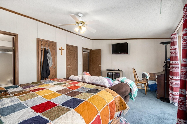 bedroom with ceiling fan, carpet floors, a textured ceiling, and multiple closets