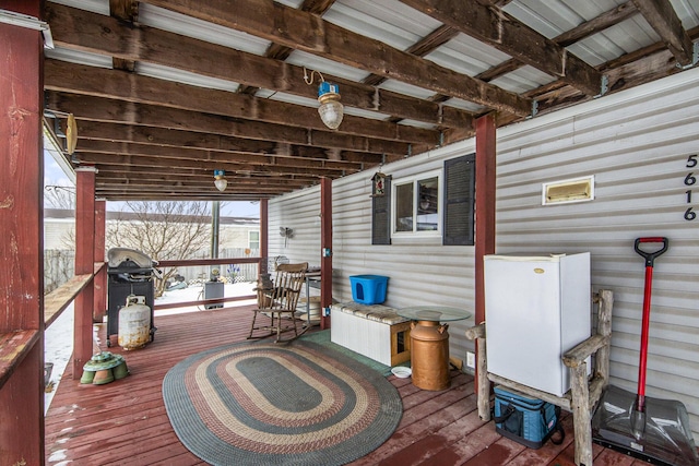 wooden deck featuring grilling area