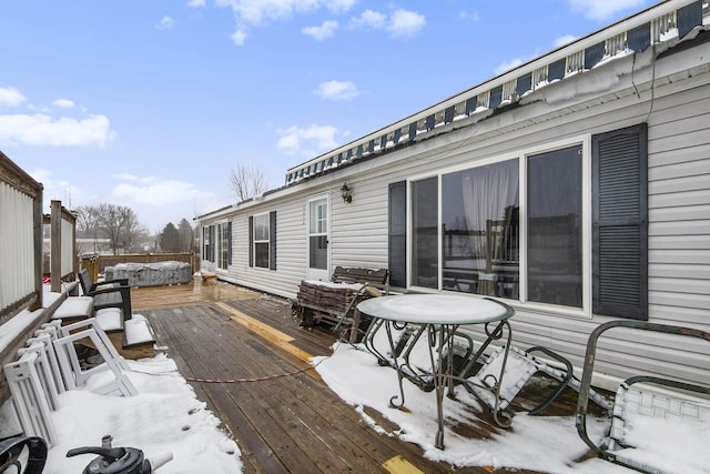 view of snow covered deck