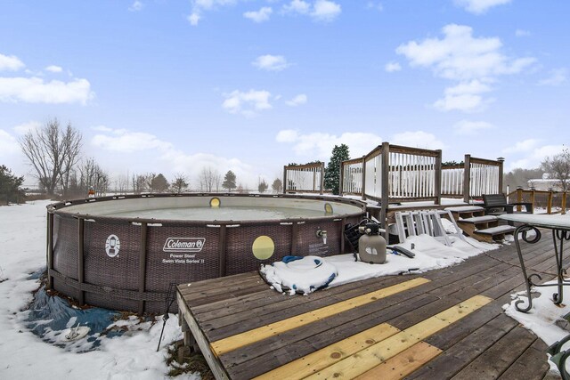 view of snow covered deck