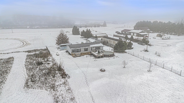 snowy aerial view with a rural view