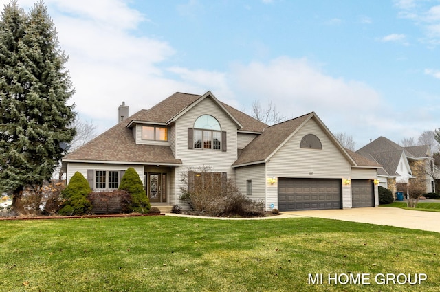 front of property featuring a front yard and a garage