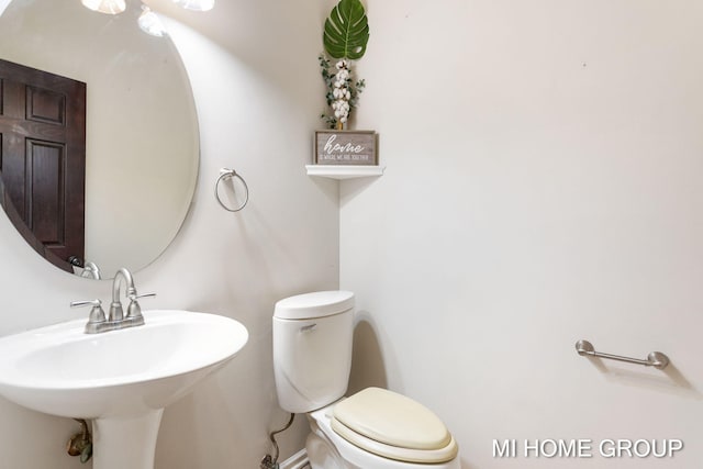 bathroom with toilet and sink