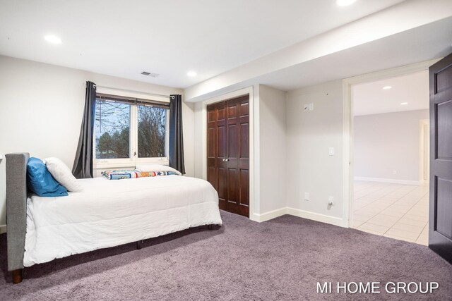 bedroom with carpet floors and a closet