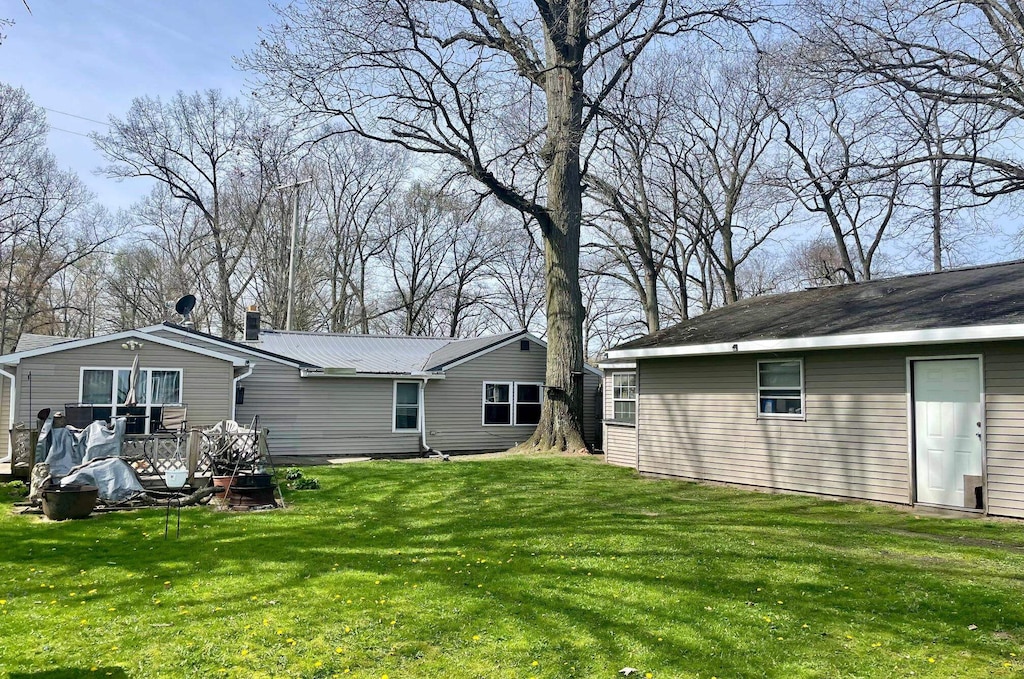 back of house with a yard