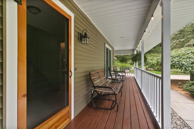 wooden terrace with a porch