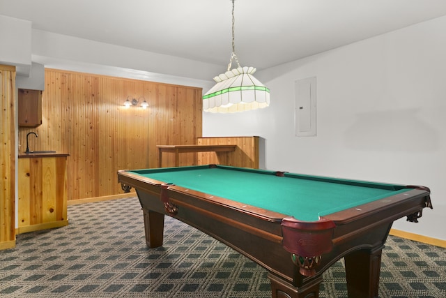 game room featuring electric panel, wooden walls, and pool table