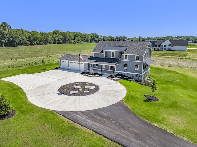 view of front of property with a garage and a front yard