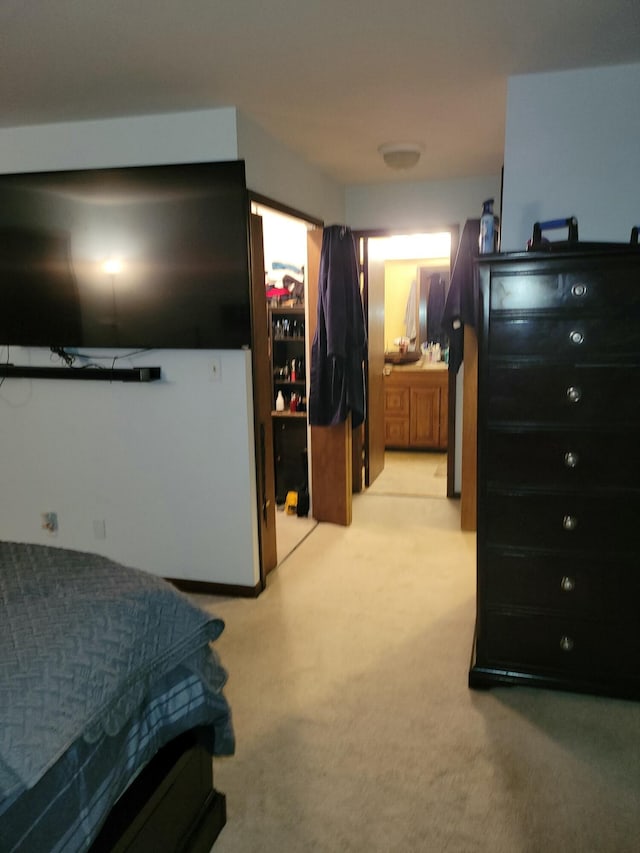 bedroom featuring light colored carpet