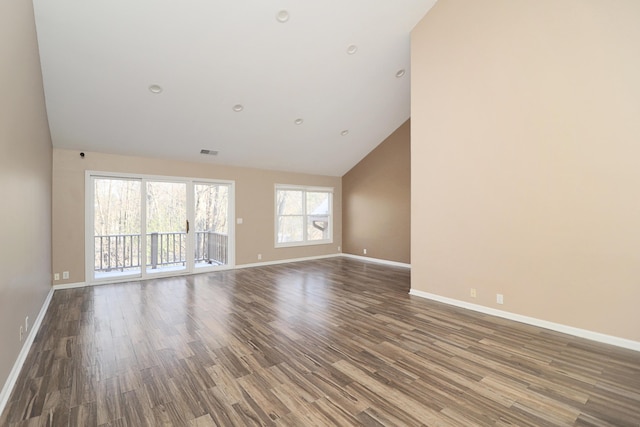 unfurnished room with high vaulted ceiling and hardwood / wood-style flooring