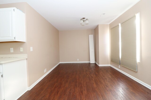 interior space with dark hardwood / wood-style flooring and a chandelier