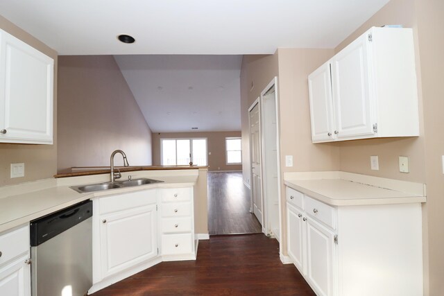 kitchen featuring kitchen peninsula, white cabinetry, dishwasher, and sink