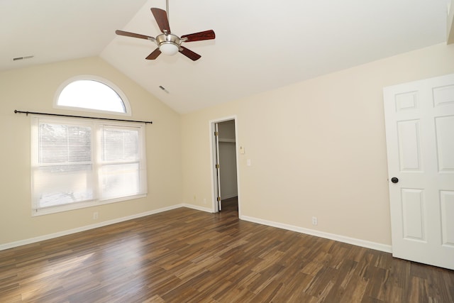 unfurnished room featuring ceiling fan, dark hardwood / wood-style floors, and lofted ceiling